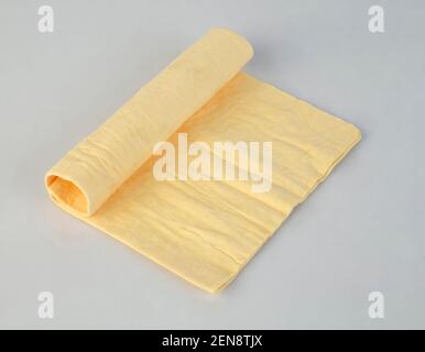 Roll of chamois leather isolated on white background Stock Photo
