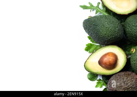 Fresh avocados pieces Isolated on white background with copyspace. Top view. Stock Photo