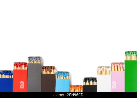 multi color matchboxes lined up like up and down grahpic on white with clipping path Stock Photo