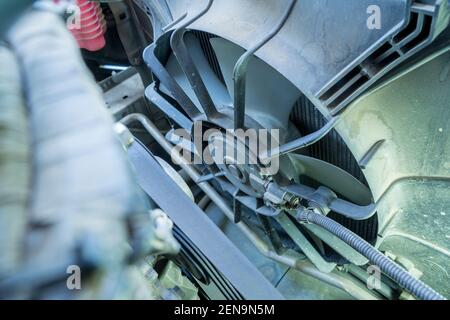 Fan of the radiator on the disassembled car,cooling system of an old car. Stock Photo