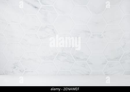 Light white grey marble hexagon tile wall with white wood board as floor, empty interior for presentation, display, design. Stock Photo