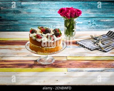 Victoria Sponge Cake with Chocolate Strawberries Stock Photo