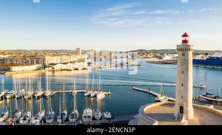 Aerial panorama of the port of Sete and the Saint Louis lighthouse, on a summer morning, in Herault in Occitanie, France Stock Photo