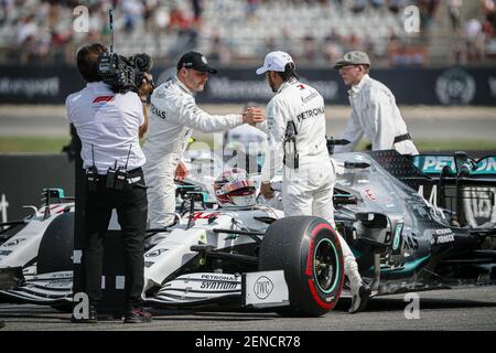 Mercedes AMG Petronas F1 Team’s Finnish driver Valtteri Bottas and British driver Lewis Hamilton shake hands after the qualifying session of the German F1 Grand Prix. (Photo by Jure Makovec / SOPA Images/Sipa USA)