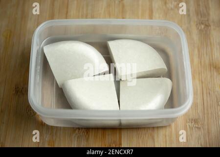 Homemade Soya paneer cheese made from fresh milk and lemon juice, diced and placed in a bowl on a wooden background. Horizontal orientation. Close up Stock Photo