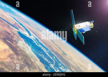 Communication satellite and research equipment in Earth orbit, flies through the deserts of Africa and Central Asia. Elements of this image furnished Stock Photo