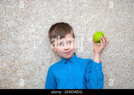 Child boy with apple, healthy food Stock Photo