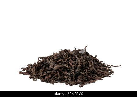 Dried tea leaves lying on the table in a slide Stock Photo