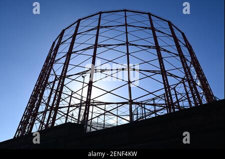 Birmingham, West Midlands UK. 26th February 2021. The last three gas holders in Birmingham, UK are to be dismantled over the coming months starting this month. The dominant structures are viewable from the M6 at Spaghetti Junction and around the Nechells area. The holders were famously painted the colours of nearby Aston Villa Football Club after the engineer in charge of maintenance opted for the colours of his favourite team. Credit: Stop Press Media/Alamy Live News Stock Photo