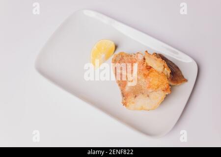 Battered fish fillet isolated over white background Stock Photo