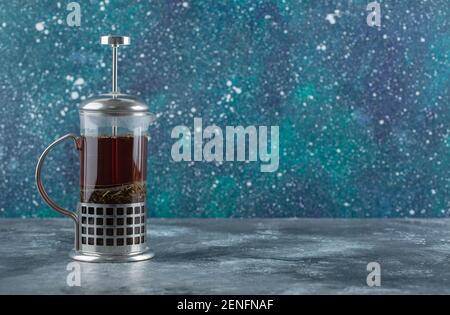 Glass teapot full with fresh fragrant tea Stock Photo