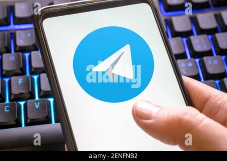 telegram logo on the blue screen of a smartphone. Messaging app on your phone. Italy, Verona, 17-02-21 Stock Photo