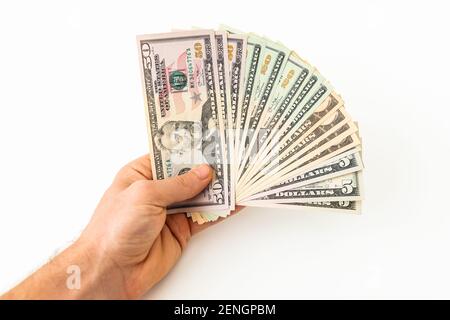 Hand with money isolated on a white background. US dollar bills Stock Photo