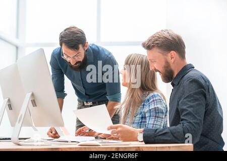 business team discussing business documents in the workplace Stock Photo