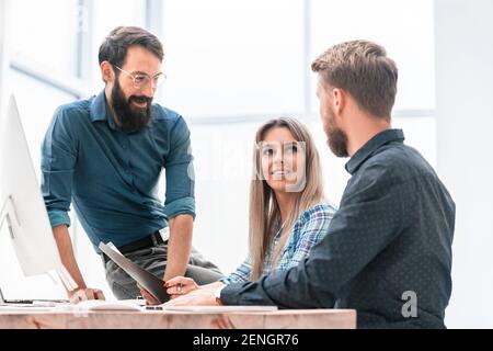 colleagues extending their hands to each other for a handshake Stock Photo