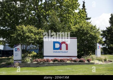 A logo sign outside of the headquarters of Diebold Nixdorf in North ...