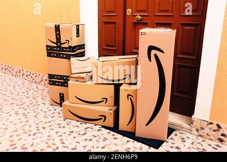 AMAZON Cardboard Boxes delivered at home to the front door Stock Photo