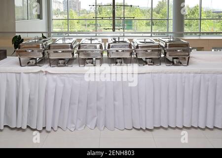 Food Warmers Trays Ready at Buffet Table Stock Photo