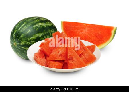 piece of watermelons on white plate with whole and half watermelon in background  isolated on white Stock Photo