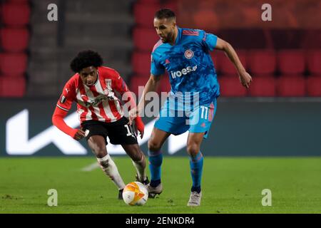 EINDHOVEN, NETHERLANDS - FEBRUARY 25: Pablo Rosario of PSV, Youssef ElArabi of Olympiacos during the UEFA Europa League match between PSV and Olympia Stock Photo