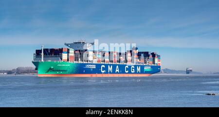 The LNG-powered containership, the CMA CGM Louvre, on the river Elbe near the city of Hamburg, Germany. Ship is leaving the port of Hamburg on Sunday Stock Photo