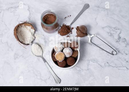 homemade energy balls - truffles made of cocoa and coconut shavings Stock Photo