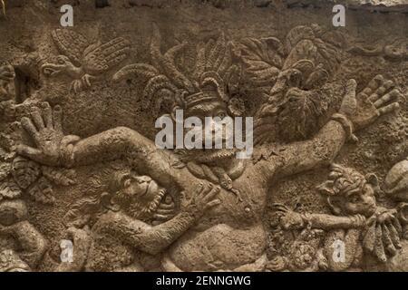 Hindu figures carved on the wall in Bali Stock Photo