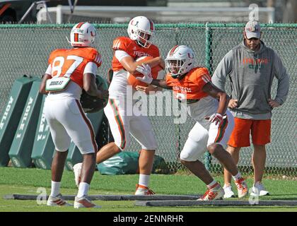 Miami tight end Michael Irvin II (87) is upended by defensive back