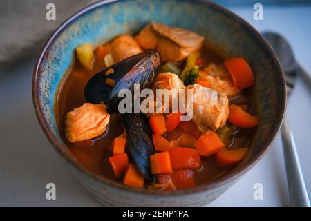 Bowl of fresh seafood soup with mussels Stock Photo