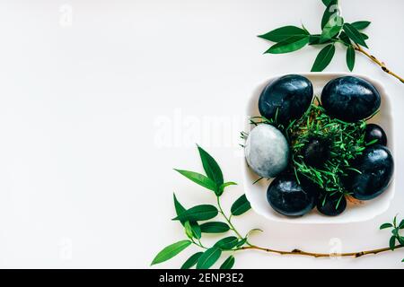 Minimalist black and gray monochromatic trendy Easter flatlay. Natural coloring concept. Eco design. Stock Photo