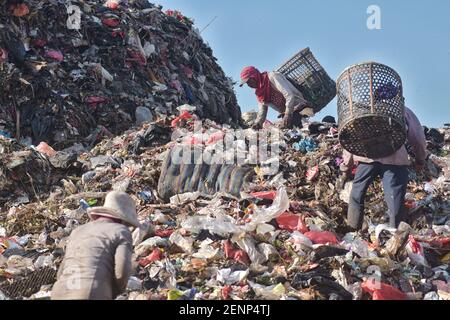 Scavengers Sort And Collect Plastics For Recycling At The Garbage 