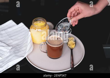 Bulletproof coffee, keto breakfast made with butter and MCT oil Stock Photo