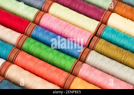 Colorful cotton thread reels close up picture. Stock Photo