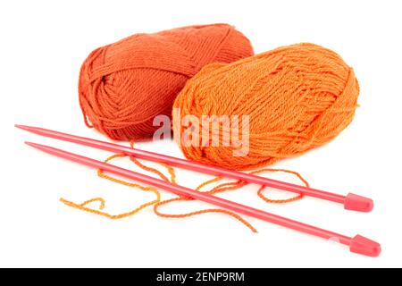 Two knitting yarn clews and knitting needles isolated on white background. Stock Photo