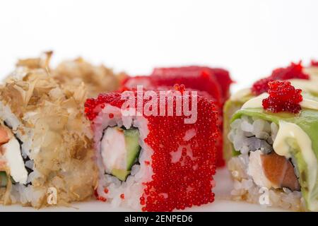 Delicious sushi roll with tobiko caviar. Macro. Photo can be used as a whole background. Stock Photo