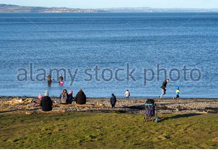 Edinburgh, Scotland, UK. 26th Feb 2021. Granton harbour and Wardie Bay with a view over the Forth Estuary on a cold and sunny late afternoon.  Credit: Craig Brown/Alamy Live News Stock Photo