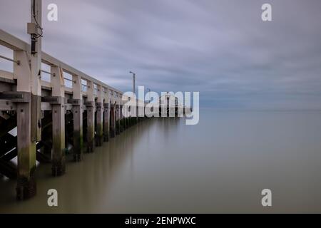 Traditional wooden pier in Blankenberge, on the Belgian North Sea Coast. Stock Photo