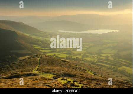 A view of Llangorse lake and the Brecon Beacons from Mynydd Troed, Black Mountains, Wales, UK. Stock Photo