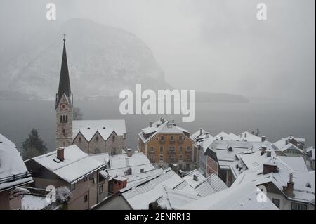 Hallstatt village from above in winter during snowfall, Hallstatt, Inner Salzkammergut, Austria Stock Photo