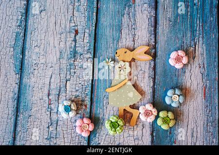 Wooden Easter bunny with flowers as decoration. Stock Photo