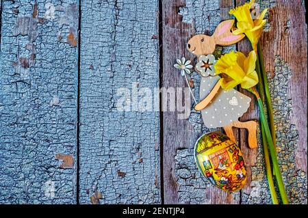 Wooden Easter bunny with flowers as decoration. Stock Photo