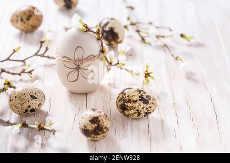 Easter eggs on with cherry branch. Easter decoration with copy space Stock Photo