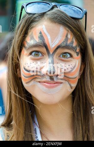 Three girls in festive hats and face paint celebrating Canada Day Rustico  Prince Edward Island Canada Stock Photo - Alamy