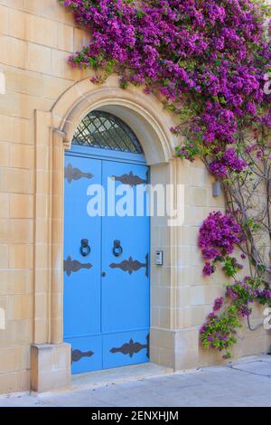 Beautiful traditional Maltese blue door with lion-shaped door knockers in the Old Town of Mdina, Malta Stock Photo