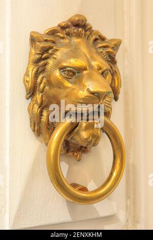 Traditional brass lion-shaped Maltese door knocker in Valletta, Malta Stock Photo