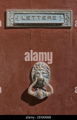 Traditional ornate Maltese lion head-shaped door knocker and letter box in Valletta, Malta Stock Photo