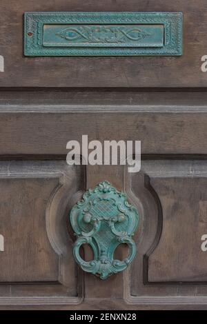 Traditional ornate metal Maltese door knocker and letter box in Valletta, Malta Stock Photo