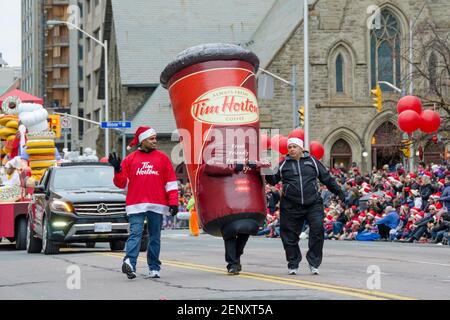 https://l450v.alamy.com/450v/2enxt5a/large-tim-horton-coffee-marching-in-the-celebration-of-the-109th-edition-of-the-santa-claus-parade-more-than-a-half-million-people-attend-the-parade-2enxt5a.jpg