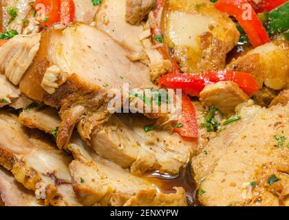 Roast pork meat in the tray: Traditional Cuban cuisine with meat and vegetables Stock Photo