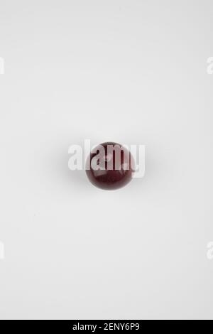 Single cherry plum isolated on white background Stock Photo